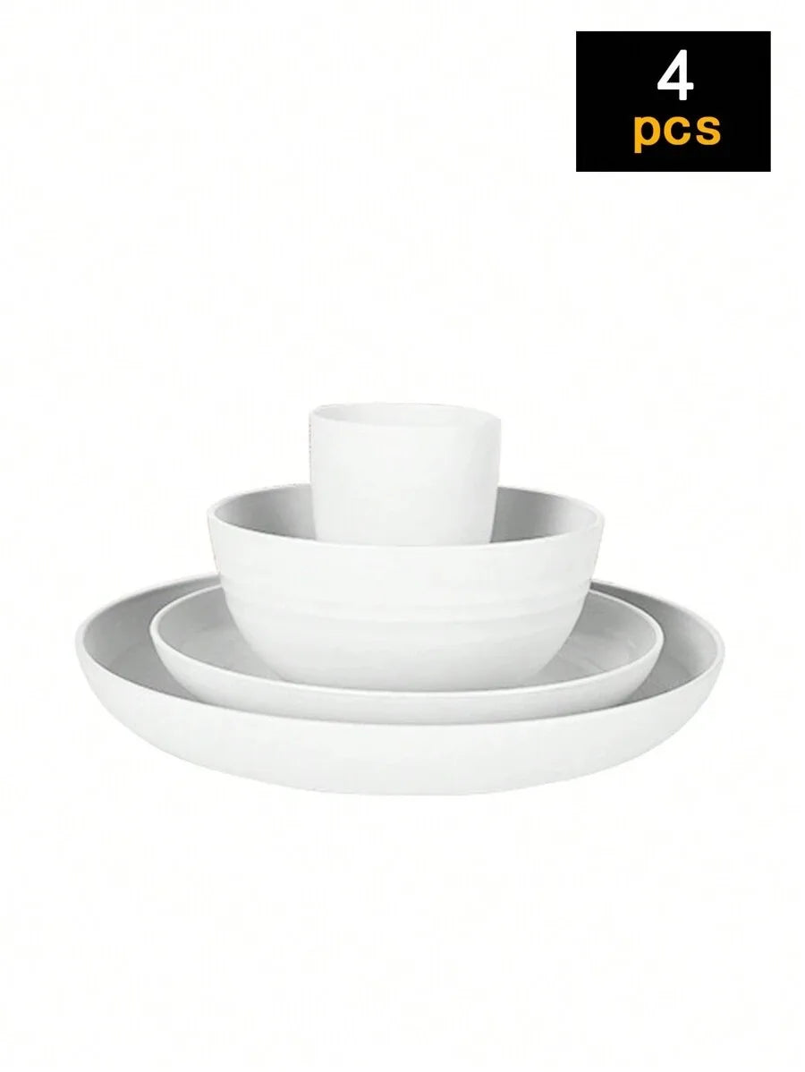 A set of four white reusable plastic tableware items including a bowl and a plate.