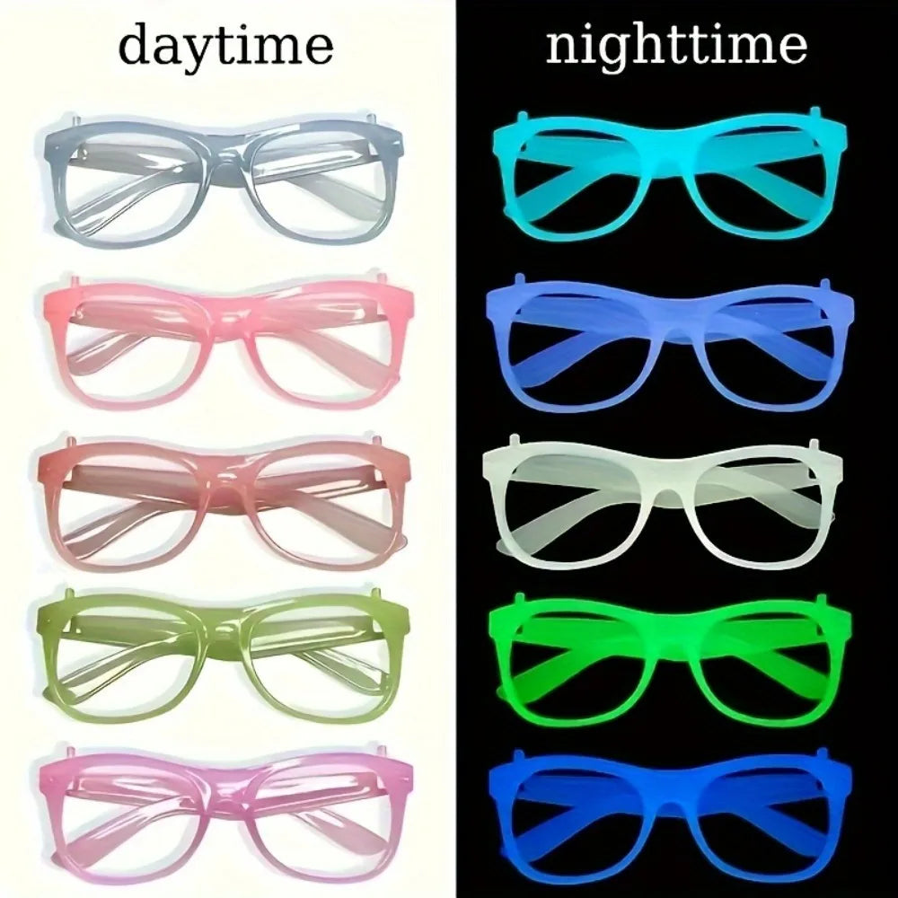 A collection of glow in the dark party glasses in various colors including clear, pink, blue, and green.