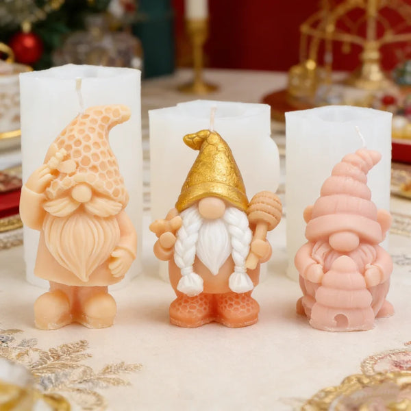 A silicone candle mold shaped like a gnome with a honeycomb hat and white beard, featuring peach and orange tones.
