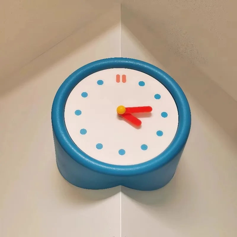 A round blue resin wall clock with a white face and red hands displaying the time.