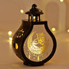 Elegant black lantern with a glass dome featuring gold Arabic calligraphy of the moon and star for Ramadan and Eid