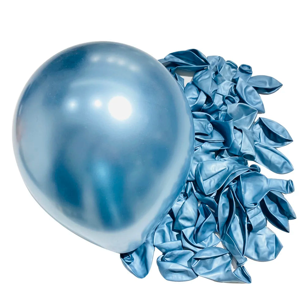 A large, shiny blue latex balloon next to a pile of crumpled, metallic blue latex balloons for party decor.