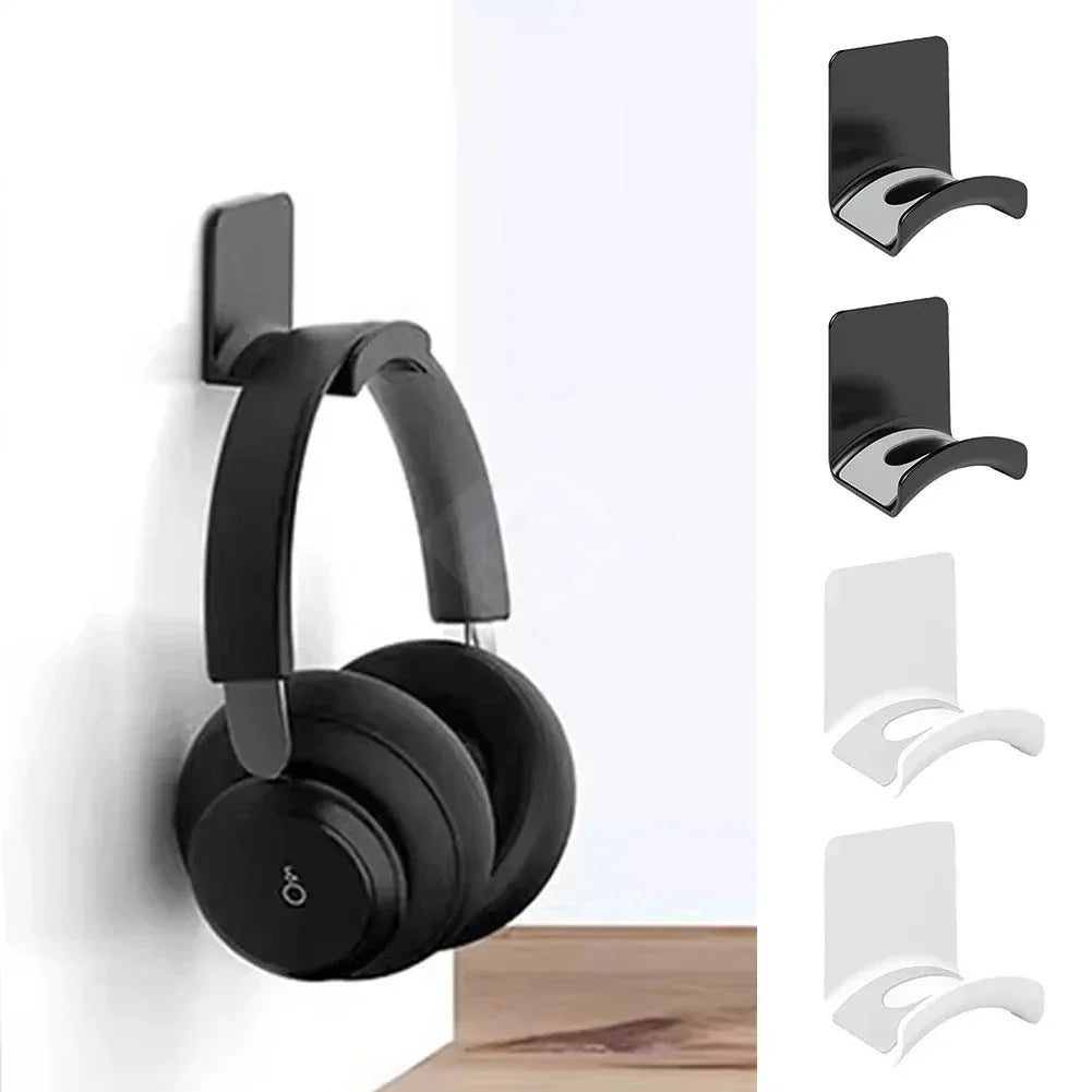 Black adhesive headphone stand mounted on a white wall.