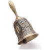 Ornate brass hand call bell with a golden handle and decorative floral embossing.