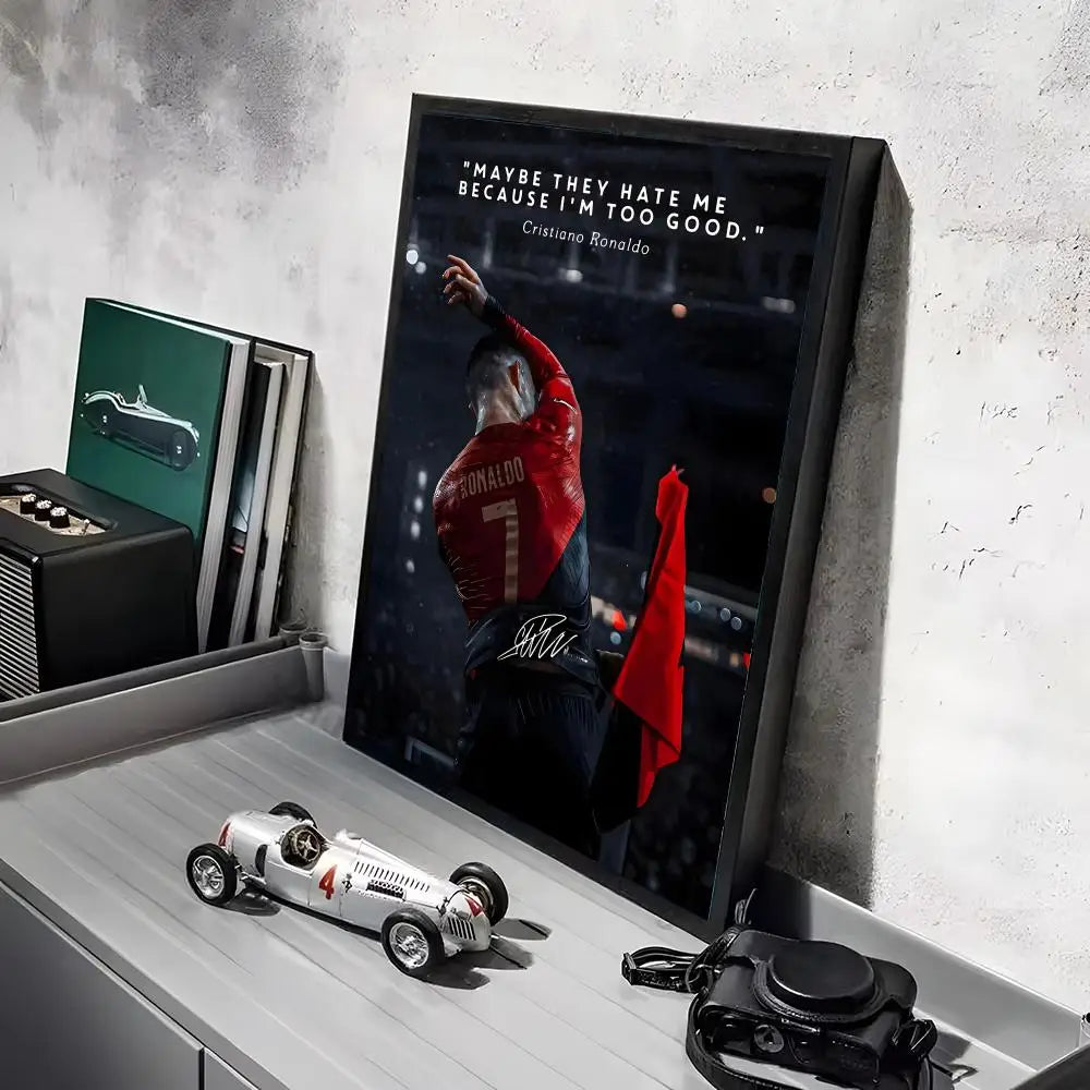 A framed poster featuring a portrait of Cristiano Ronaldo with the quote "Maybe they hate me because I'm too good."