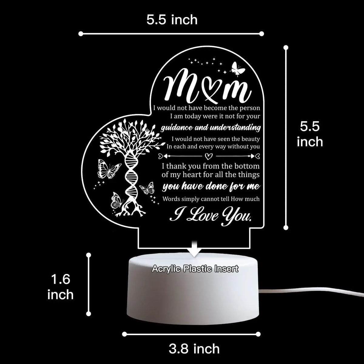A decorative acrylic night light featuring a heart design and text on a black background.
