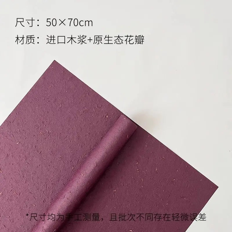 A sheet of purple decorative packaging paper, measuring 50x70cm, is shown rolled up.
