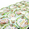 A green and white tableware set for a Wild One birthday party featuring animal prints like lions, elephants, and monkeys.