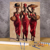 A paint by numbers kit featuring a portrait of two African women in red dresses and traditional head coverings.
