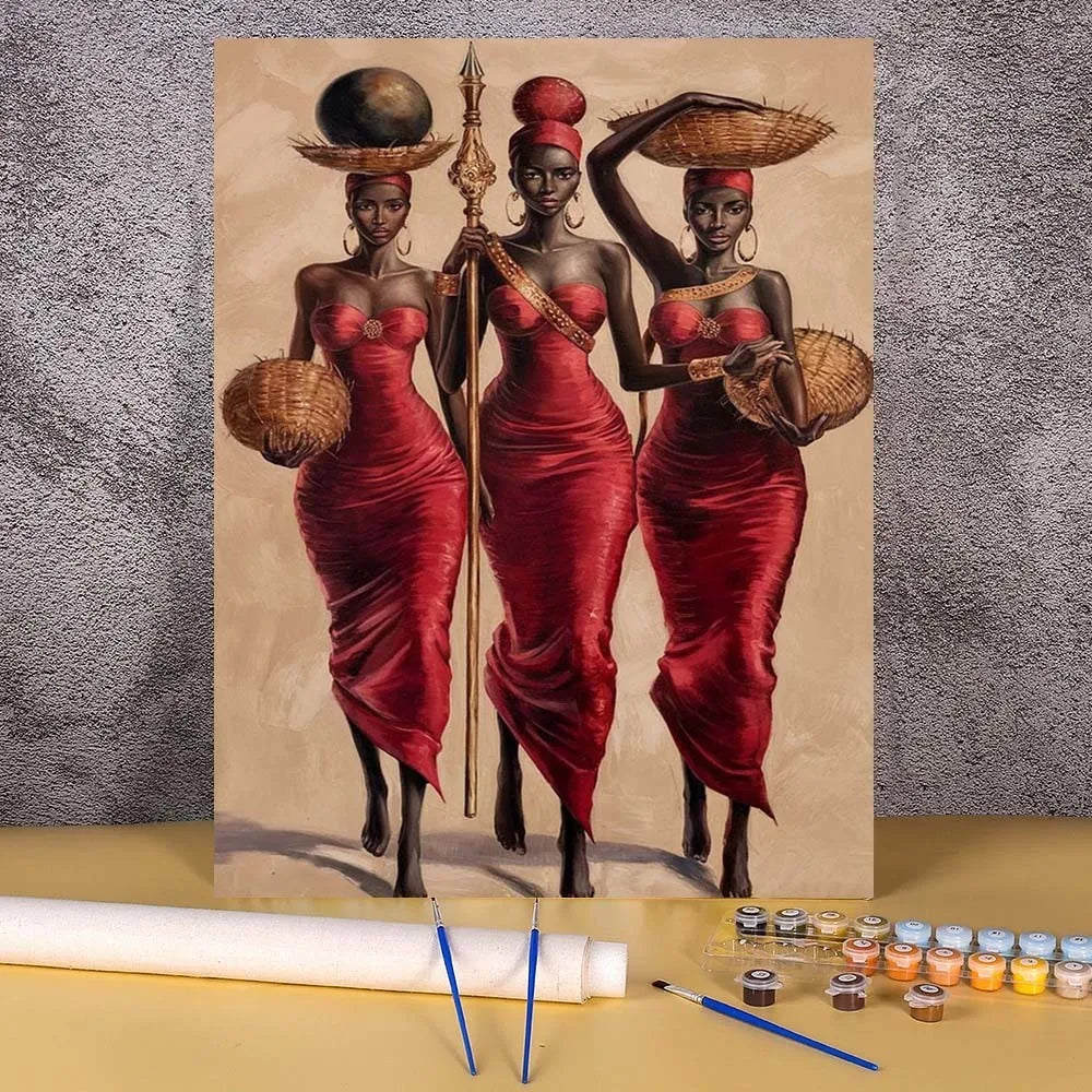 A paint by numbers kit featuring a portrait of two African women in red dresses and traditional head coverings.