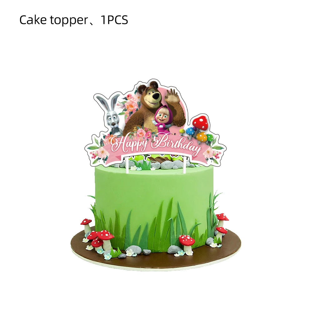 A green cake decorated with a topper featuring a bear, a rabbit, and birthday text.