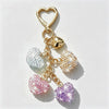Gold-toned crystal heart rhinestone keychain and bag charm with a heart pendant.