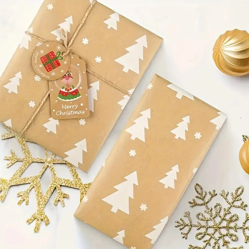 A roll of festive snowflake Christmas wrapping paper in brown featuring white Christmas trees and snowflakes.