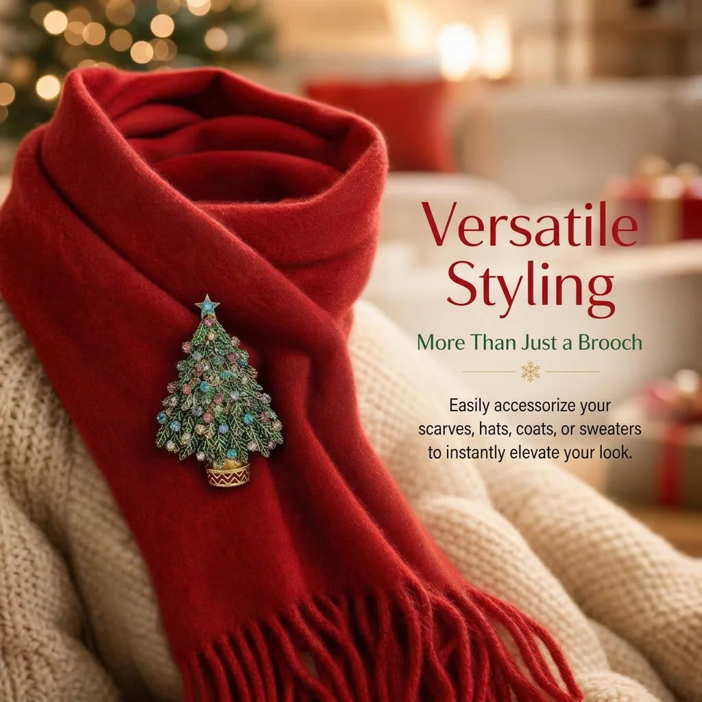 A red knitted scarf with a green rhinestone Christmas tree brooch pinned to it.