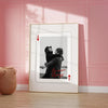 A framed photo of a couple embracing with the text Become Always on personalized playing cards.