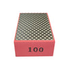 A rectangular polishing pad with a textured black surface and a pink base, marked with the number 100.