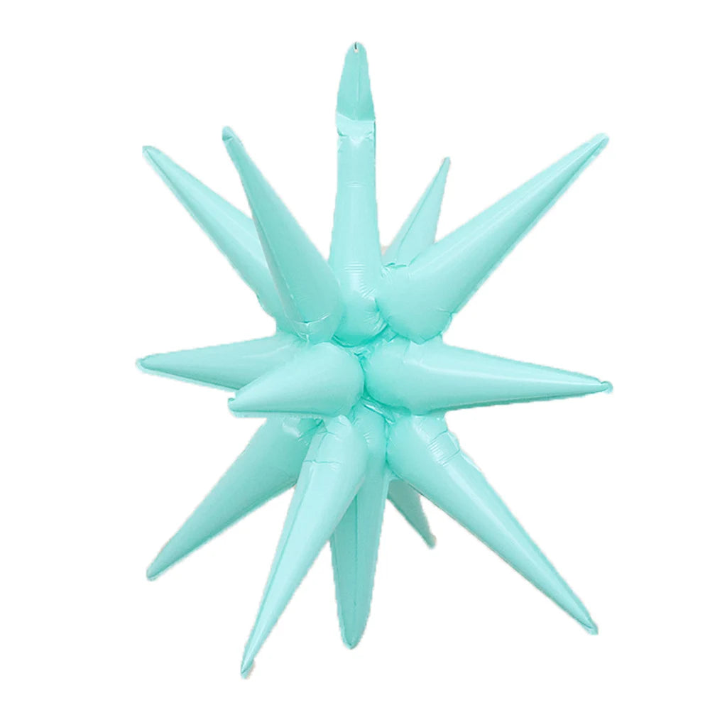 A cluster of light blue star burst foil balloons for party decor