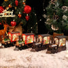 A set of decorative Christmas train music boxes with LED lights and crystal balls displayed on a snowy surface.