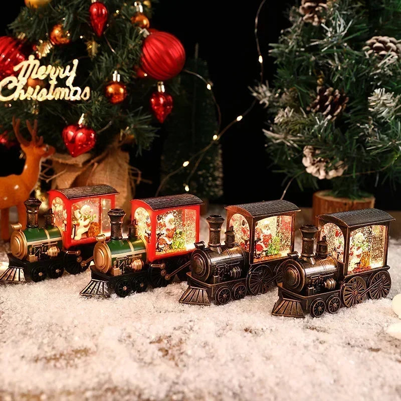 A set of decorative Christmas train music boxes with LED lights and crystal balls displayed on a snowy surface.