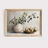 Abstract canvas art featuring a vase of greenery and pears in a rustic wooden frame.