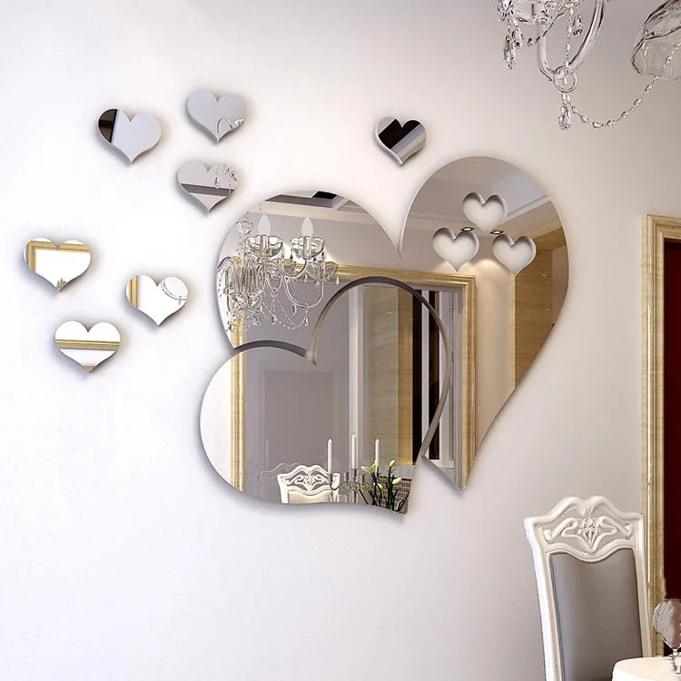 Elegant 3D acrylic heart wall art decals featuring various sized hearts on a white wall.