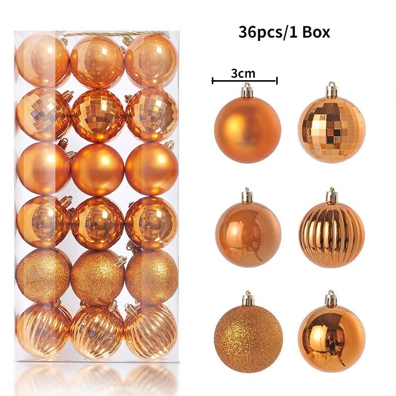 A box containing 36 gold and bronze glitter Christmas tree ornament balls.