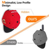 A red baseball cap with hidden hat hooks designed for low-profile wall storage.