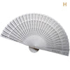 White hand carved bamboo folding fan shown open with intricate cutouts