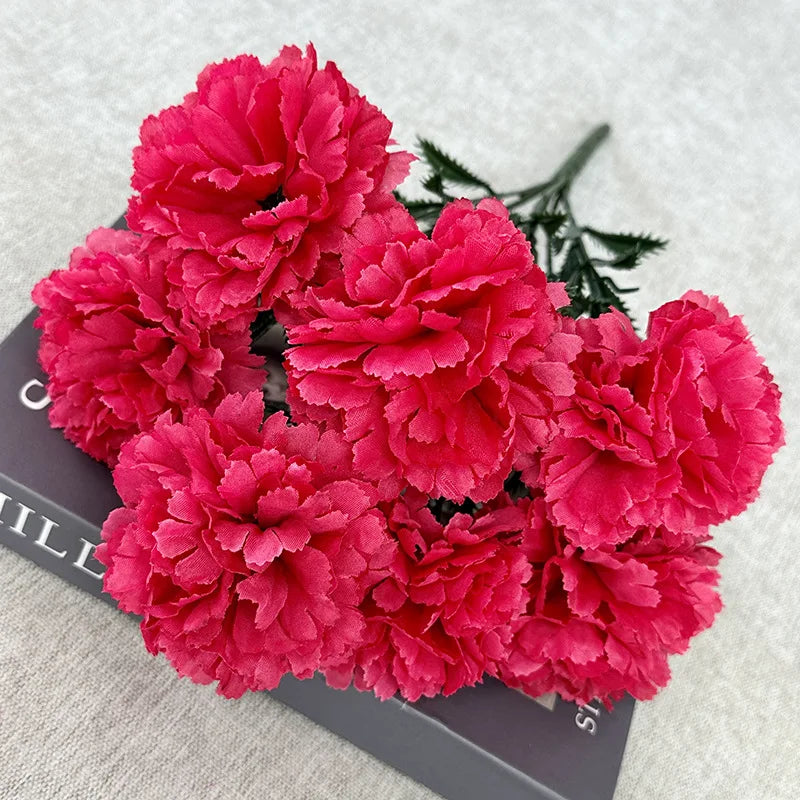 A vibrant bouquet of pink and magenta silk artificial chrysanthemum flowers.