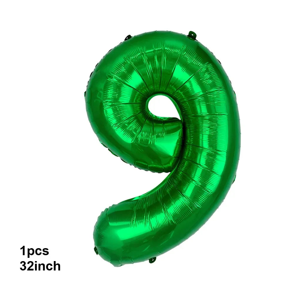 A single, bright green, inflated latex balloon shaped like the number nine.