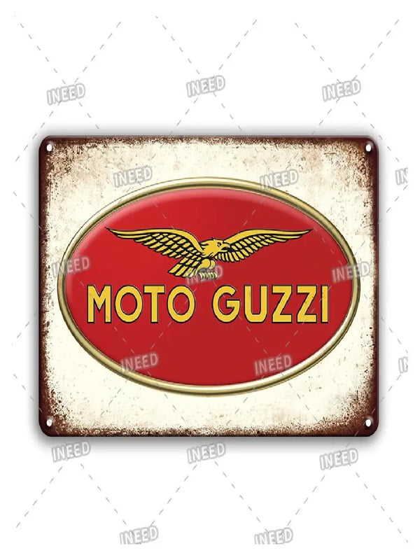 Vintage metal sign with a red oval featuring the text MOTO GUZZI on a distressed background.