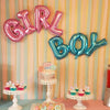 Pink and blue foil letter balloons spelling GIRL BOY for a gender reveal party display