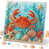 Kit de pintura de diamantes con un cangrejo naranja vibrante rodeado de flora marina azul y verde y estrellas de mar.
