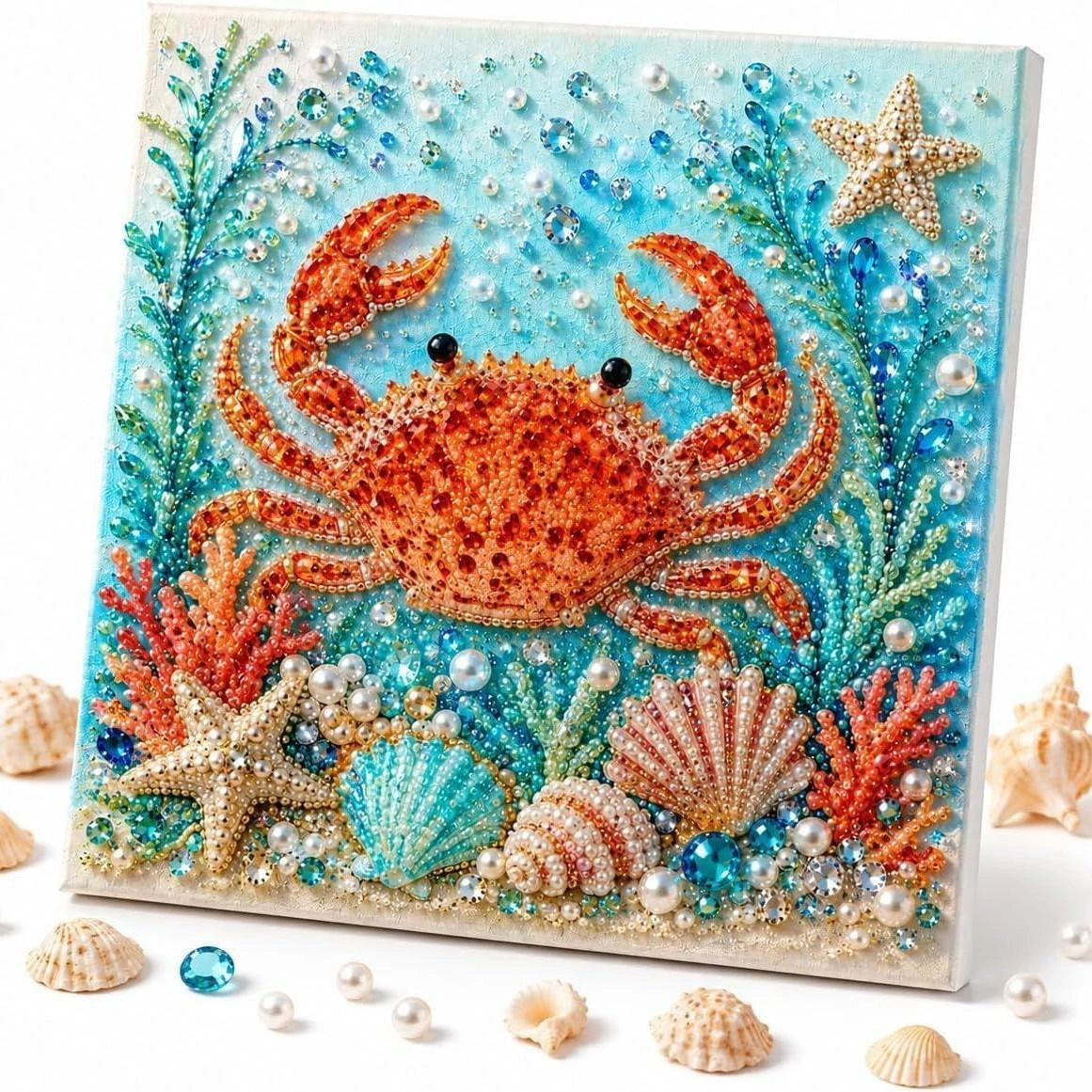 Kit de pintura de diamantes con un cangrejo naranja vibrante rodeado de flora y estrellas de mar azules y verdes.