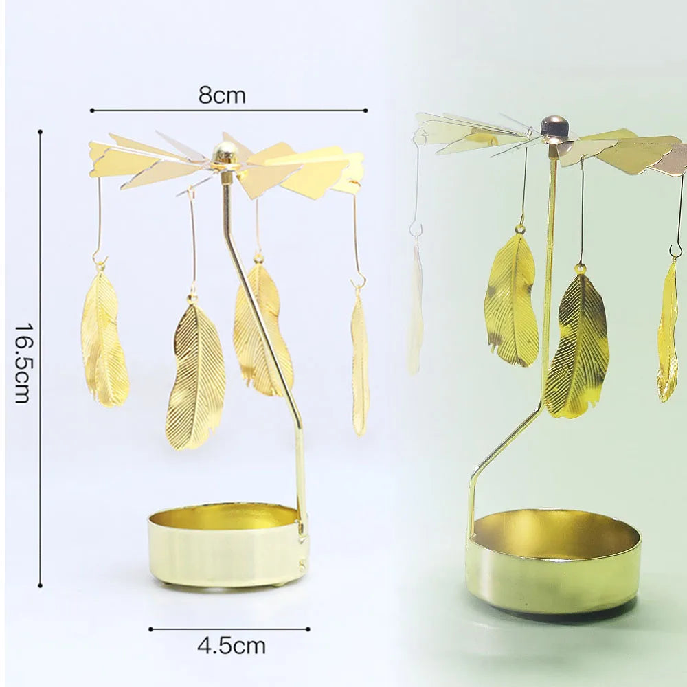 Gold rotating candle holder with feather-like arms and a circular base for tealights