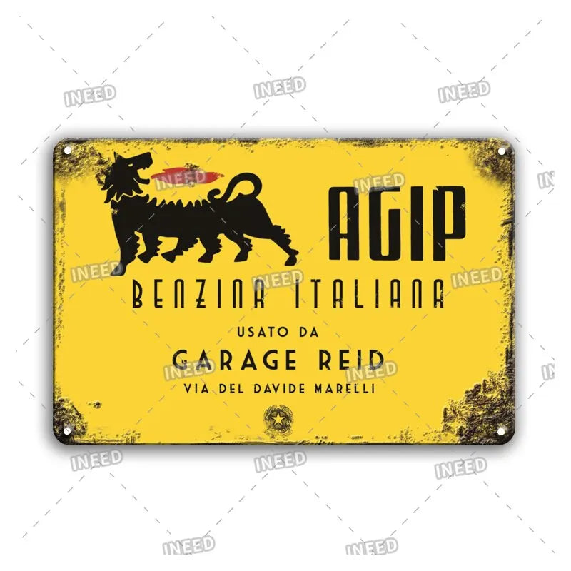 Vintage yellow metal sign with black lettering for AGIP Benzina Italiana, featuring a silhouette of a lion.