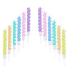 A set of purple and green ocean wave birthday candles in a vertical arrangement.