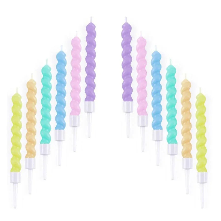 A set of purple and green ocean wave birthday candles in a vertical arrangement.