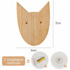 A light wood decorative animal hook with pointed ears, shown next to installation methods.