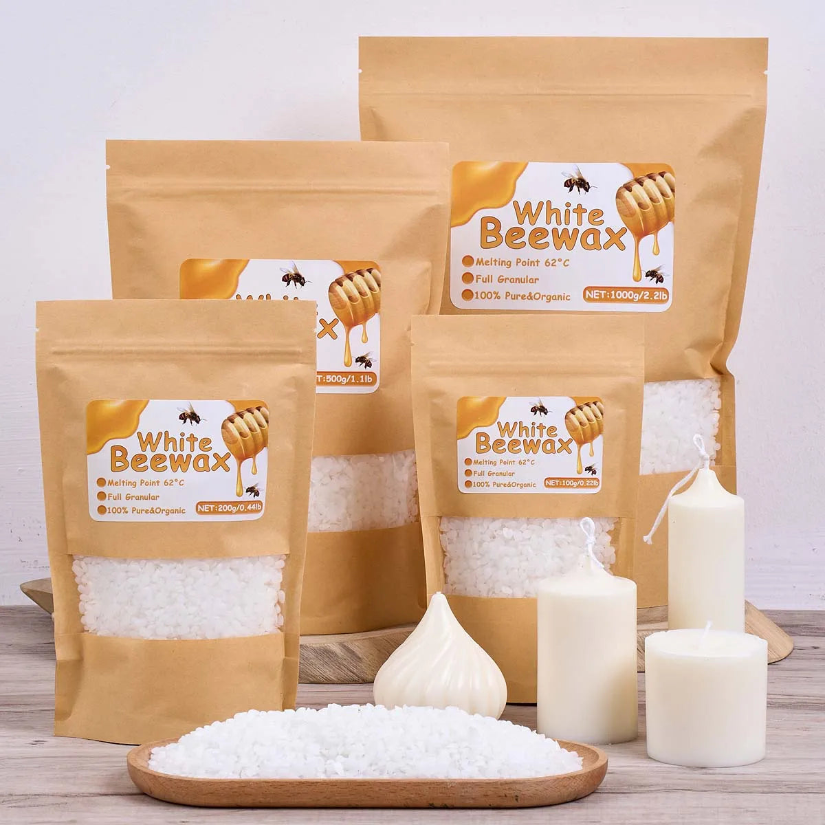 Several bags of White Beewax and loose white beeswax are displayed next to candles.