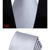 A silver striped silk necktie shown being worn with a black shirt and jacket.