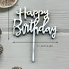 Silver acrylic birthday cake topper set with the words Happy Birthday on a stick