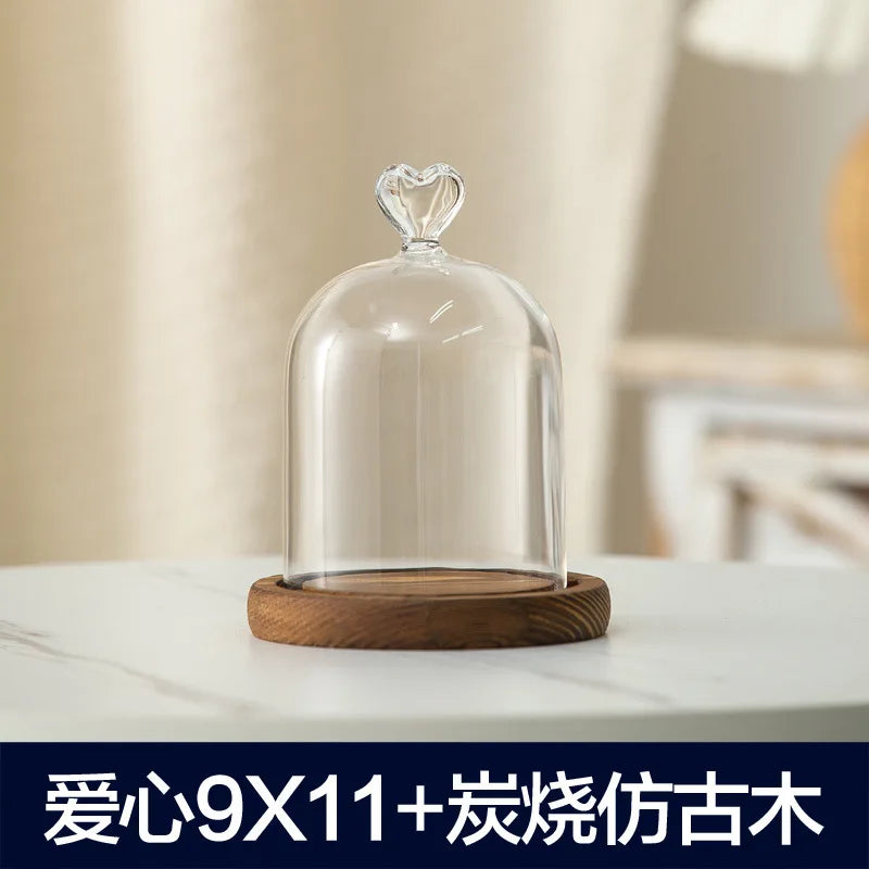Glass aromatherapy candle holder with a clear dome and wooden base for dust-proof use