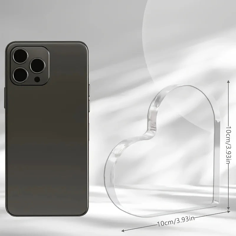 A dark gray smartphone with a clear heart-shaped protective case shown next to its dimensions.