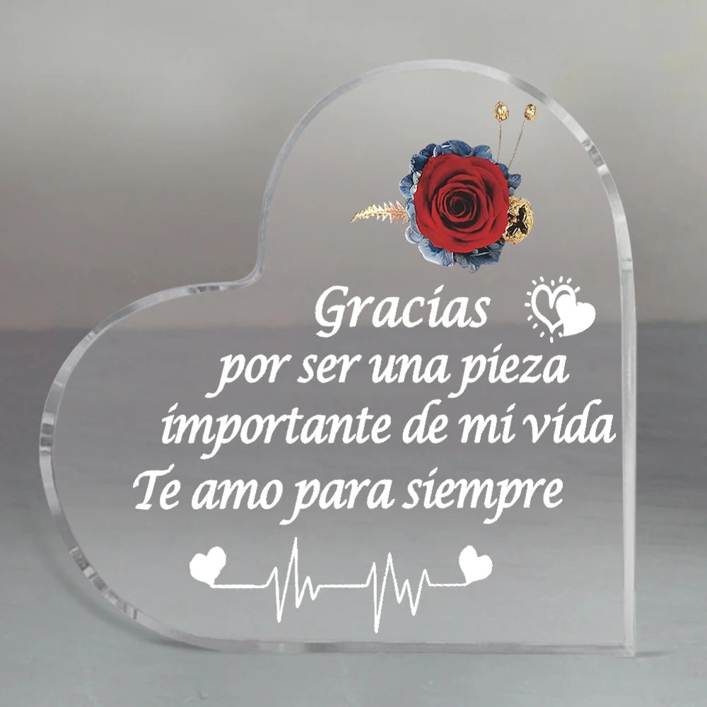 Clear glass heart-shaped keepsake frame with a red rose and text that reads Gracias por ser una pieza importante de mi vida T