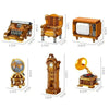 A set of six miniature furniture and appliance models made of wood or plastic in a vintage style.