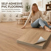 A woman is installing self-adhesive PVC flooring on a wooden floor, demonstrating easy peel and stick installation.