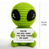 Handcrafted crochet green alien doll with a white card that reads You're the best thing I've ever found on Earth