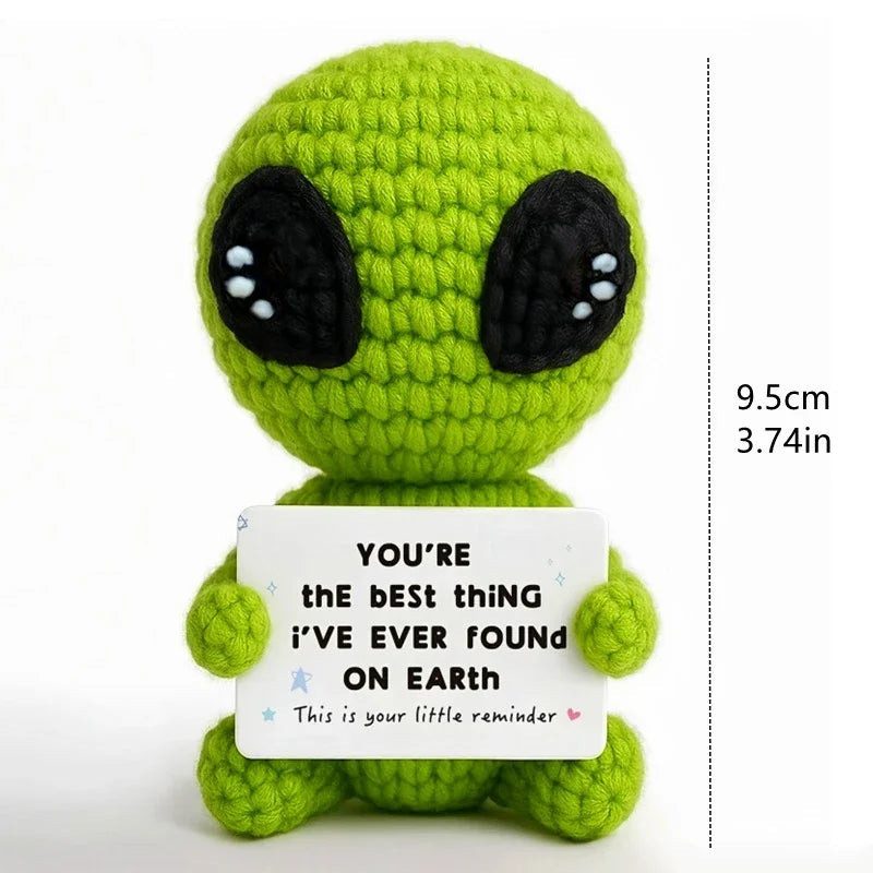 Handcrafted crochet green alien doll with a white card that reads You're the best thing I've ever found on Earth