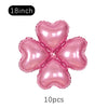 A set of ten pink heart-shaped foil balloons, 18 inches each, for party décor.